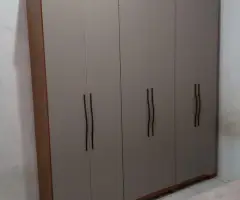 Gray wardrobe with hinged doors